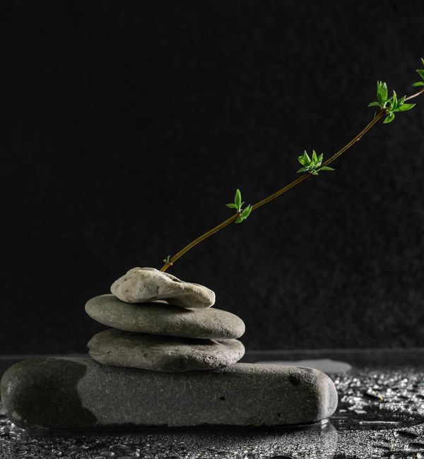 A balanced stack of stones on a serene background, symbolizing inner peace.